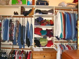 A portion of the master bedroom closet